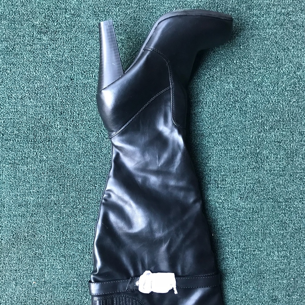 Black leather heeled knee high boots